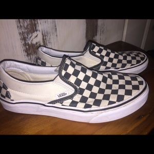 Vans checkered sneakers.